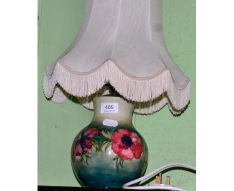 A Moorcroft table lamp in the poppy pattern, 21cm (excluding fitting)