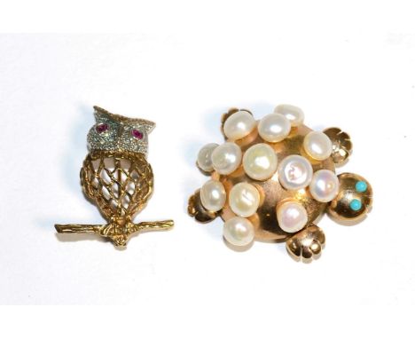 A 9 carat gold ruby and diamond owl brooch, with ruby set eyes, pavé set diamond head and pierced body, measures 3cm by 2.5cm