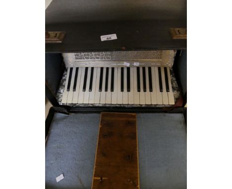 A cased piano accordion 