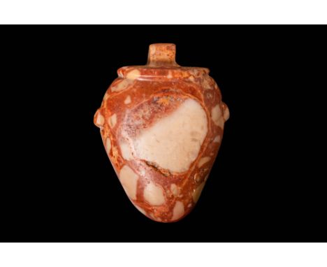 Late Period, Ca. 664 - 332 BC.A porphyry stone heart vessel amulet. The heart is stylised, resembling a pot complete with lug