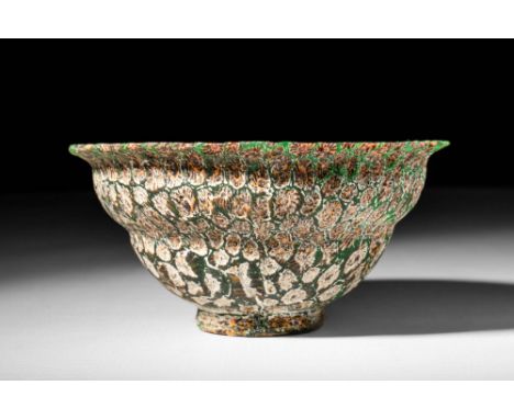 Ca. 100 BC - AD 100.A stunning Roman mosaic glass bowl made in the form of a patella bowl. The glass bowl presents a mesmeris