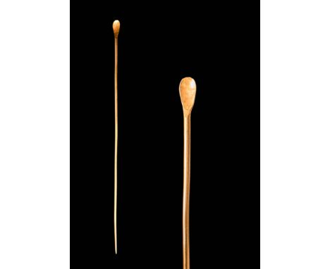 Ca. AD 100 - 300.An ancient Roman gold spoon, featuring a long, narrow shaft leading to a small, spoon-shaped end. It was lik