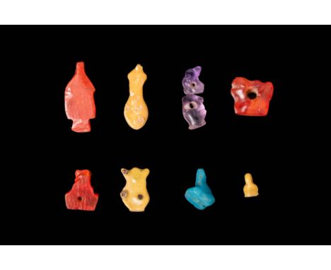 Late Period, Ca. 664 - 30 BC.A collection of nine amulets crafted from stone and faience. Each amulet is intricately carved, 