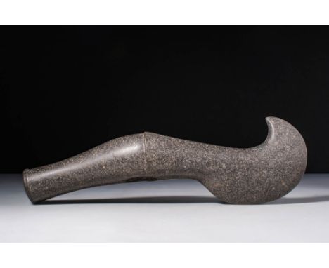 Ca. 4000 - 3000 BC.A head of an axe with a carinated body in black stone extremely polished. On side A there is a recurve upw