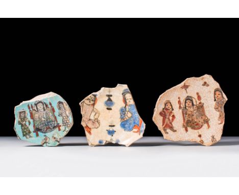 Ca. AD 1100 - 1200.A collection of three Minai pottery sherds, each painted with polychrome and gilt overglaze. The first and