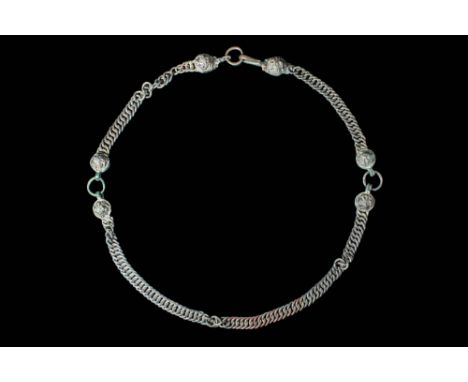 Ca. 300 BC.A Hellenistic necklace comprised of a finely woven bronze chain. It has six decorated hinges with stylised floral 