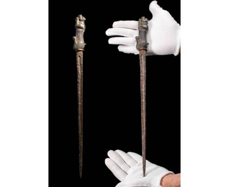 Ca. 800 - 500 BC.A Western Asiatic rare Iron dagger with a leaf-shaped doubled-edged blade. The blade is ribbed lengthways an