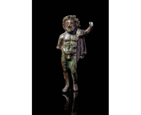 Ca. AD 100 - 300.A Roman bronze statuette of a nude Zeus depicted as a mature man with a muscular physique, shoulder-length h