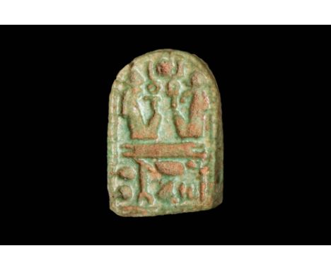 Late Period, Ca. 664 - 332 BC.A green faience amulet in the shape of a plaquette depicting a profile of baboon-Thoth made wit