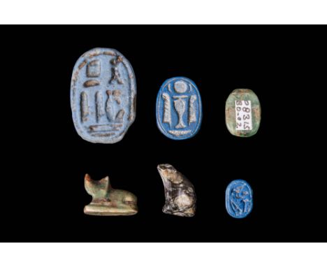 Late Period, Ca. 664 - 332 BC.A collection of six scarabs and amulets, the four scarabs of ovoid form with naturalistic featu