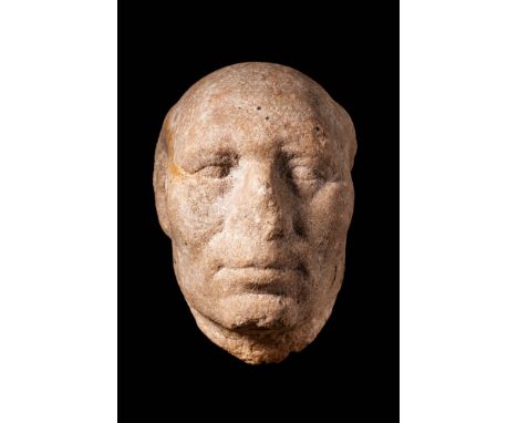 Ptolemaic Period, Ca. 400 BC. A granite head of a priest. The partial baldness of the official indicates maturity, with tufts