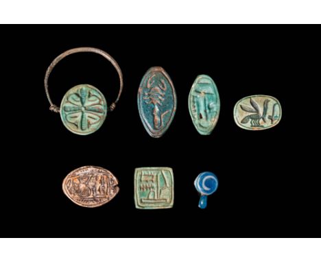 New Kingdom to Late Period, Ca. 1550 - 332 BC.A collection of amulets, including four scarabs. Two scarabs have elongated bod