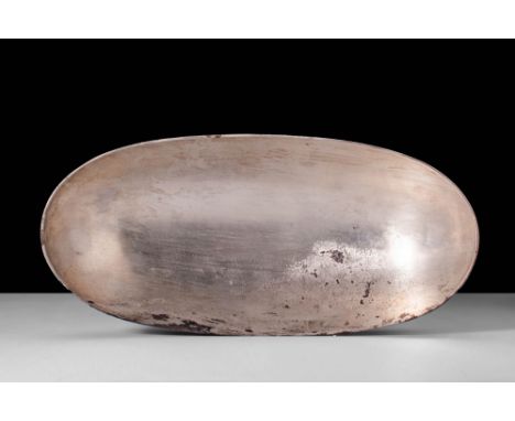 Ca. AD 200 - 600.A Sassanian bowl of lustrous silver hues with an elliptical form. The ovoid vessel features a larger elongat