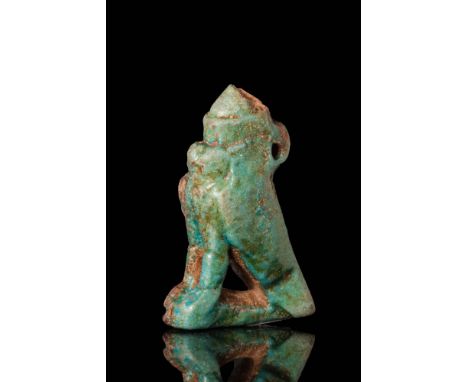 Ca. 1069 - 664 BC.An intricate, mould-made, pale blue-green faience amulet in the form of Horus, depicted here with his falco