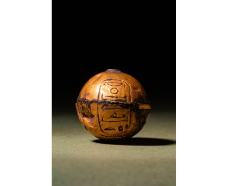New Kingdom, Ca. 1279 - 1152 BC.A hollow gold bead, spherical in shape, composed of two joined halves. The surface bears a ca