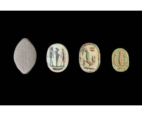 Late Period, Ca. 664 - 30 BC.A collection of four scarabs, three with ovoid body, carved from steatite and green stone and pr