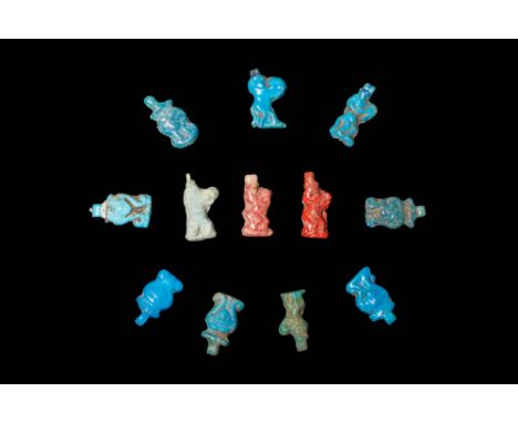 New Kingdom, Ca. 1550 - 1069 BC.A collection of 12 faience amulets including six amulets depicting the head of Hathor, shown 