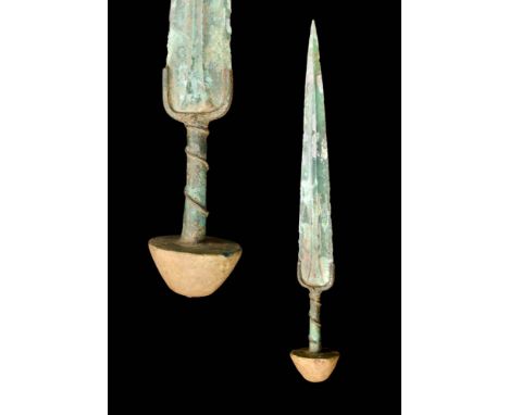 Ca. 1200 - 800 BC.A Western Asiatic/Aegean bronze dagger with a long, tapering blade, a prominent large polygonal mid-rib and