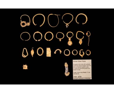 Ca. 300 BC - AD 400.A collection of over 20 gold items, predominantly loop-shaped earrings with tapered or overlapping finial
