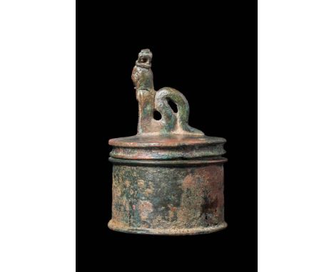 Ca. 30 BC - AD 200.An amazing Roman-Egyptian bronze pyxis, with a cylindrical body seated on a discoid everted base. The lid 