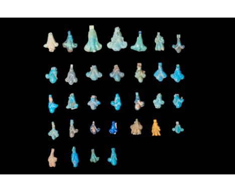 New Kingdom, Ca. 1550 - 1069 BC.A collection of 32 faience amulets. Each amulet is shaped as a blooming lotus flower, with a 