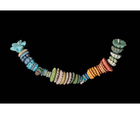 New Kingdom, Ca. 1550 - 1069 BC.A collection of 43 decorative beads exhibiting a variety of colours, including red, orange, b