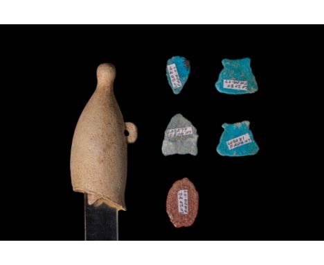 Ca. 1069 - 332 BC.A collection of six faience and stone amulets. The first is a polished pale green faience amulet crown-shap