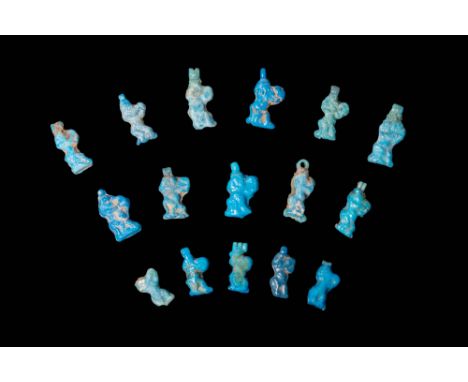 New Kingdom, Ca. 1550 - 1069 BC.A collection of 16 blue faience amulets. Each amulet depicts Bes, the dwarf god, playing a ta