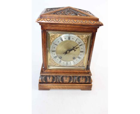 Late 19th Century carved mantel clock with striking movement, 35cm high.