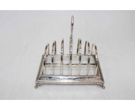 Victorian silver seven bar toast rack by Henry Wilkinson &amp; Co, Sheffield 1872, having bead border and on ornate claw feet