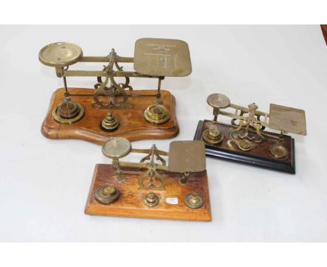 Three sets of vintage brass postal scales.