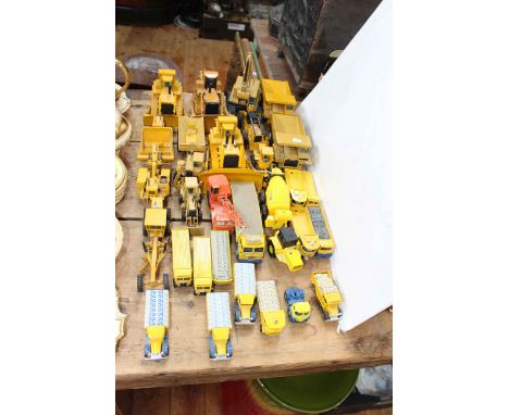 Collection of NZG, Conrad and other excavating commercial model vehicles including Blue Circle Cement, flat bed trucks, etc.