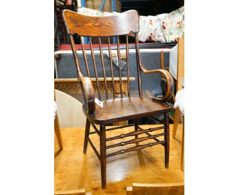 An early 20th century American elm and beech comb back armchair, width 57cm, depth 48cm, height 106cm
