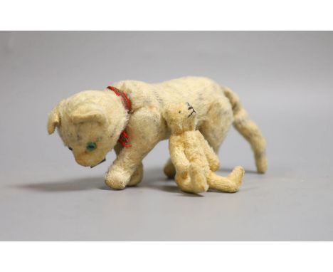 A Steiff miniature Teddy bear, 10cm high together with a cat