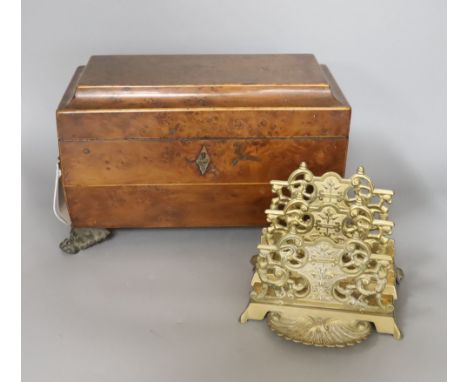 A late Georgian burr yew tea caddy, on gilt metal lion’s paw feet (lacking interior), 31 x 20cm, and a cast brass letter rack