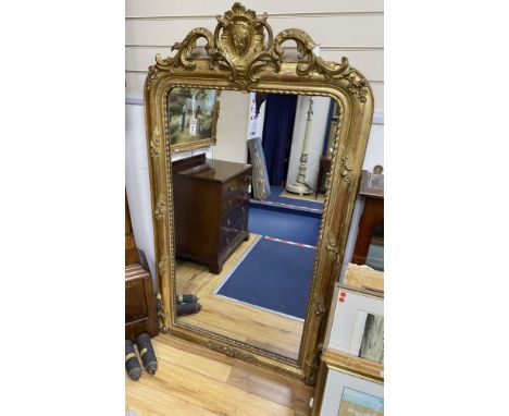 A 19th century French overmantel mirror, giltwood and gesso with channelled frame and scroll with cabochon crest detail, widt