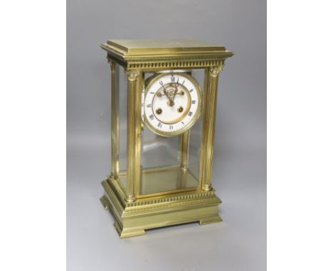 A 19th century French four-glass mantel clock with key and mercury filled pendulum bob34cm