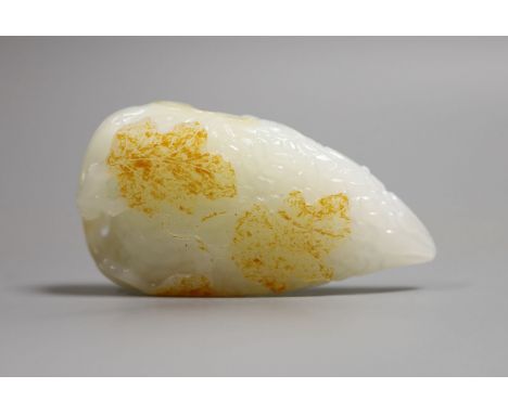 A Chinese white and russet skin jade carving, 7cm high
