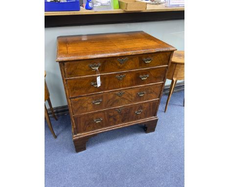An 18th century and later walnut veneered chest of four graduating drawers raised on bracket feet, width 80cm, depth 52cm, he