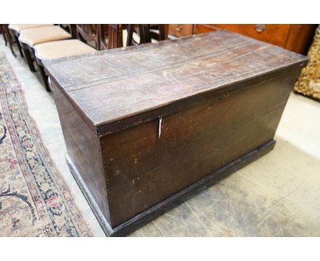 An early 19th century rectangular oak trunk, length 116cm, depth 61cm, height 66cm