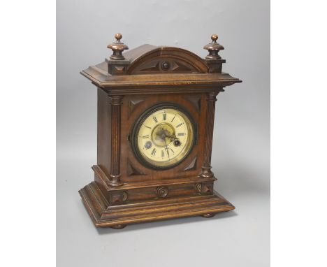 A Late 19th century German walnut mantel clock,with German striking movement34cm