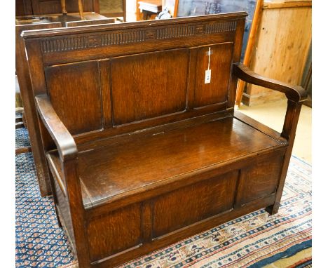 A 1920's rectangular bevelled wall mirror in oak frame, width 53cm, height 74cm together with a late Victorian wall-mounted m