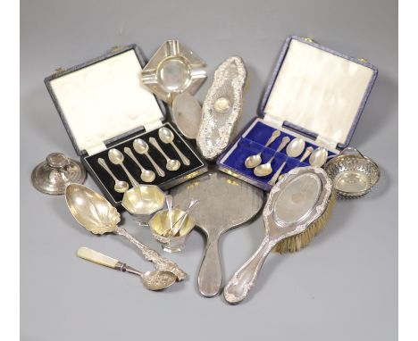 A collection of small silver including condiments, mirror and brushes, astray, cased items and a pair of sterling servers.
