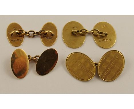 Two pairs of 18ct gold cufflinks one pair are oval with plain polished faces Birmingham 1911, the other with engine turned wa