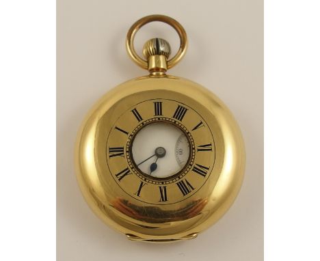 An 18ct gold half hunter pocket watch with blue enamelled dial to the outer case, white enamelled dial with subsidiary second