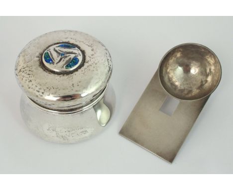An Arts and Crafts Cymric silver box for Liberty & Co, Birmingham 1904, of circular waisted form with stylised enamel decorat