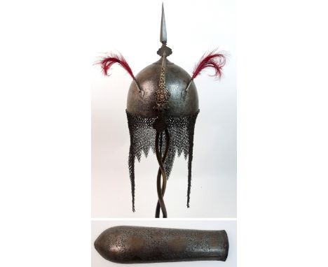An Indo-Persian Khula Khud with central spike, a pair of plumes and sliding nose guard with ornate stone set mount, the skull