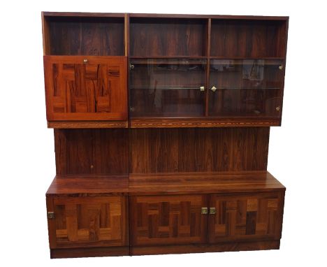 Nils Jonsson (Swedish 20th Century) A rosewood side unit produced by Troeds, with two open shelves above two glazed doors and