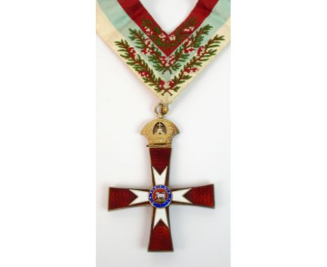 A Knights Templar gilt and enamel cross the red enamel cross with attached embroidered red, blue and white ribbon, the centra