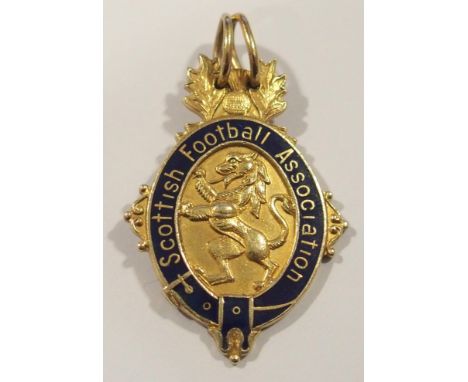 A 9ct gold and enamel 1979-80 Scottish Cup runners-up medal the obverse inscribed Scottish Football Association, the reverse 